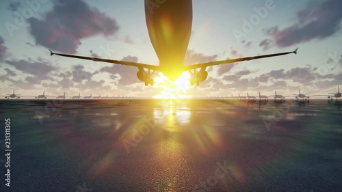 Plane takes off at sunrise or sunset background in slow motion
