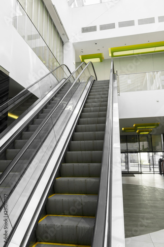 Escalator in the shopping center. Escalator in shop. Element of design. escalator and modern shopping mall interior.