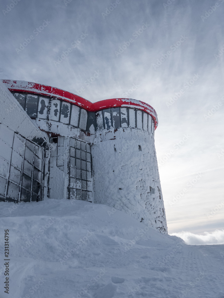 Obraz premium Hotel in snowy mountains. Winter hotel in mountains. 