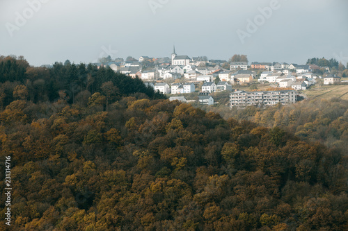 Bourscheid village on the hill with autumn colors