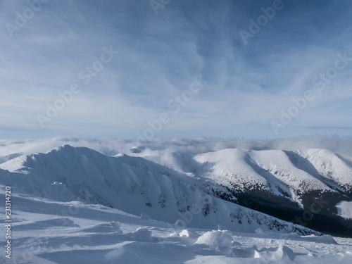 View of the snowy peaks and slopes of the mountains Low Tatras, Slovakia.