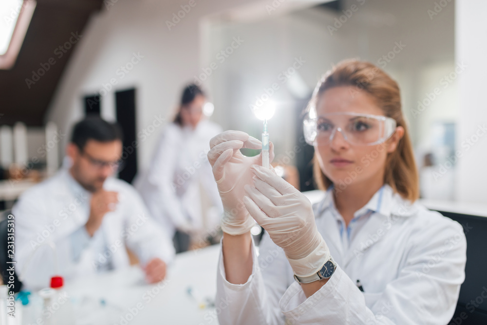 Scientists at laboratory during work. Scientists at laboratory during work.