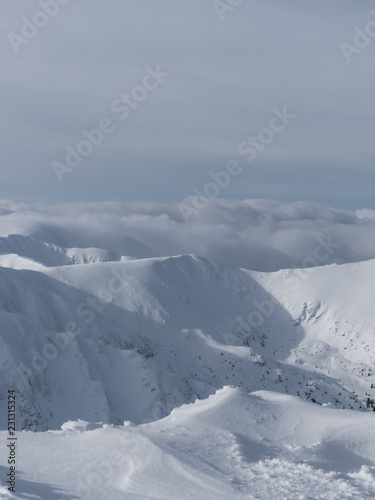 View of the snowy peaks and slopes of the mountains Low Tatras, Slovakia. © Peter