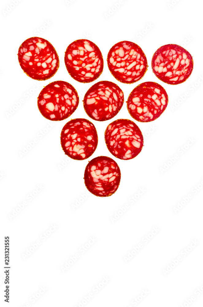 Round pieces of smoked sausage lined in the form of a triangle isolated on a white background. Round pieces of smoked sausage lined in the form of a triangle isolated on a white background.