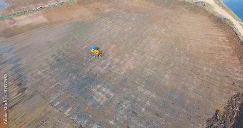 Aerial view of bulldozer on muddy3