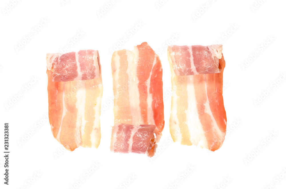 Semi-rolled up thin strips of smoked bacon isolated on white background. Semi-rolled up thin strips of smoked bacon isolated on white background.