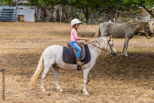 Young child learning to ride in the upper Hunter Valley, NSW, Australia. © lizcoughlan
