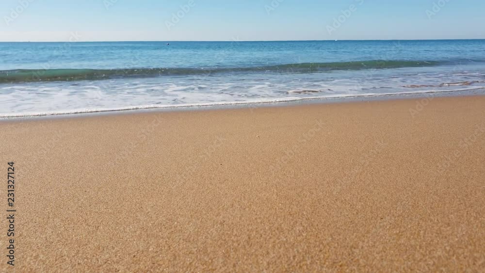 The wave floods the sandy shore. Beach, sand, waves, warm, sunny. Turkey summer. The wave floods the sandy shore. Beach, sand, waves, warm, sunny. Turkey summer.