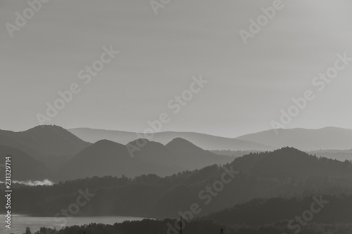 Ridges of the mountains at sunrise. Black and white.