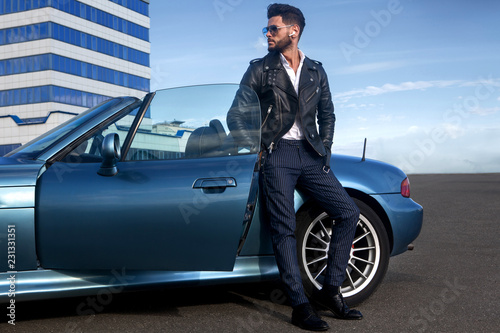 Handsome man near the car. Businessman. © ASjack