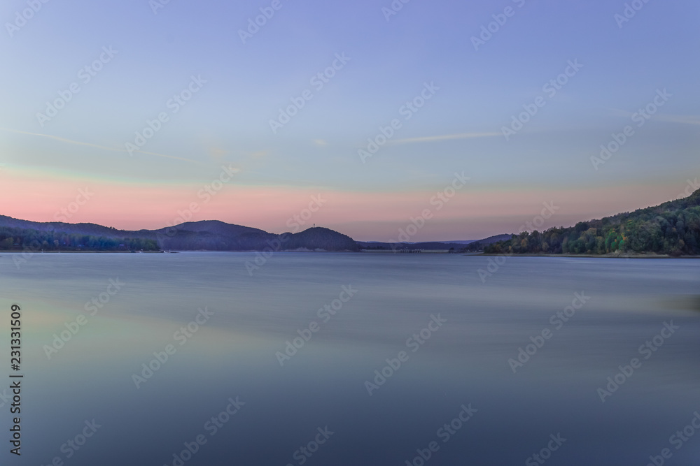 Sunset over the Solina Dam in Bieszczady Mountains area of south-eastern Poland. Long-exposure image.
