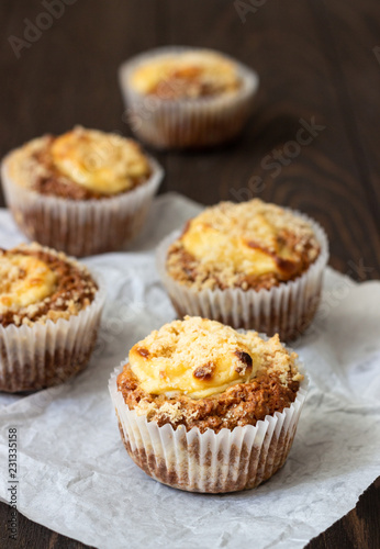 Fresh homemade muffins with cream cheese filling and streusel.