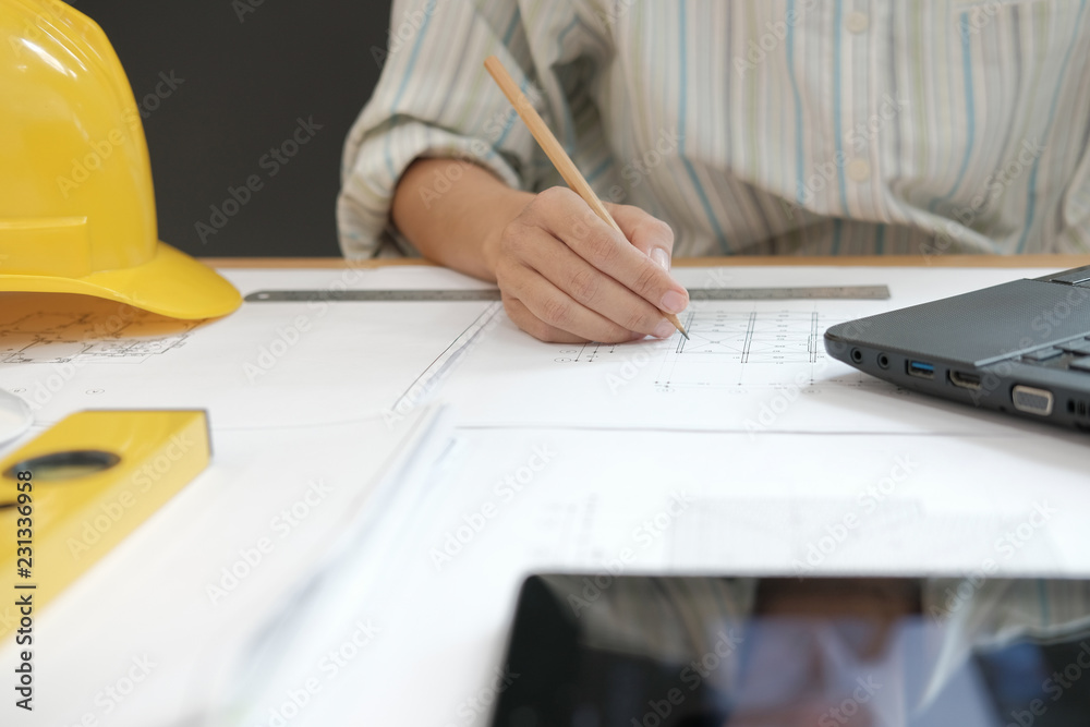 Fototapeta premium architect engineer working on house blueprint of real estate project at workplace. building construction concept