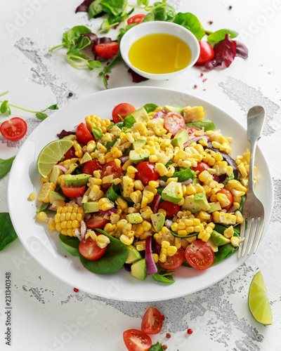 Sweet Corn salad with tomatoes, avocado, red onion, herbs and lime