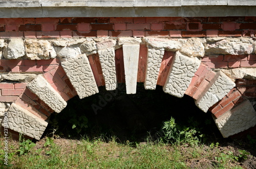 Fragment of a stone bridge in the natural-historical park 