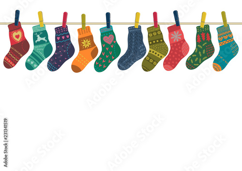 Set of warm knitted socks hanging on the rope with place for your text. Vector illustration on white background.
