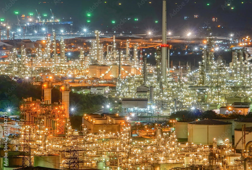 The illumination of the refinery lamp at the beautiful night.Oil refining industry.Industrial city.