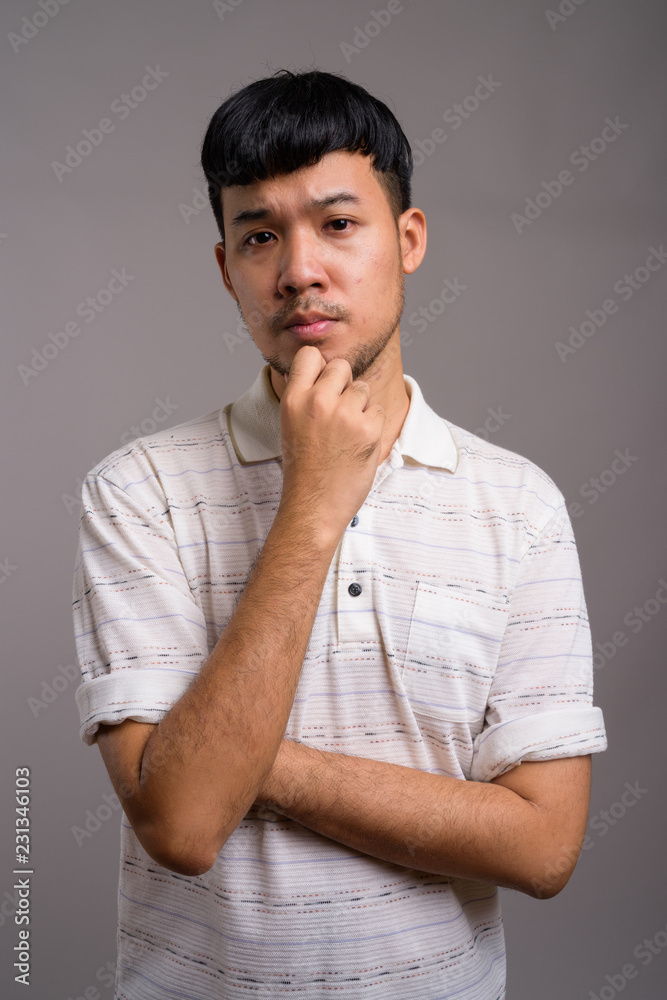 Portrait of young Asian man thinking and planning Portrait of young Asian man thinking and planning