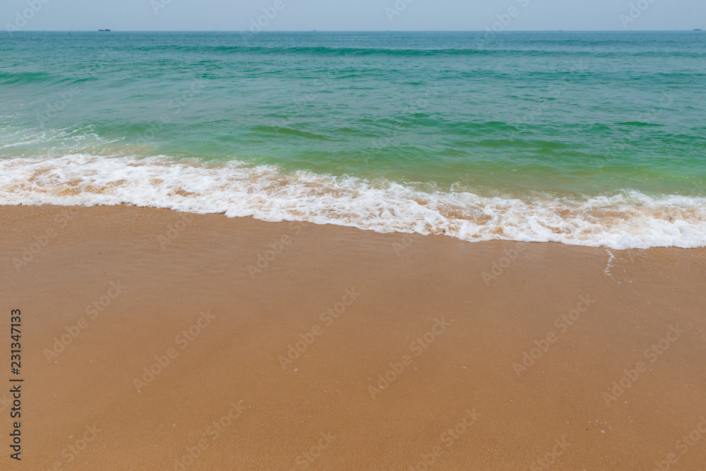 soft wave on a sandy beach soft wave on a sandy beach