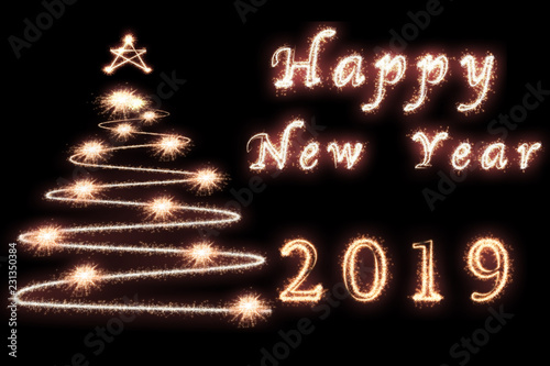 Happy new year 2019 and christmas tree written with Sparkle firework on dark background, celebration and greeting cards concept