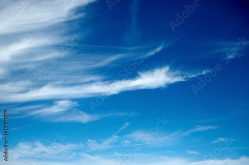 amazing white clouds of unusual shape on blue sky background