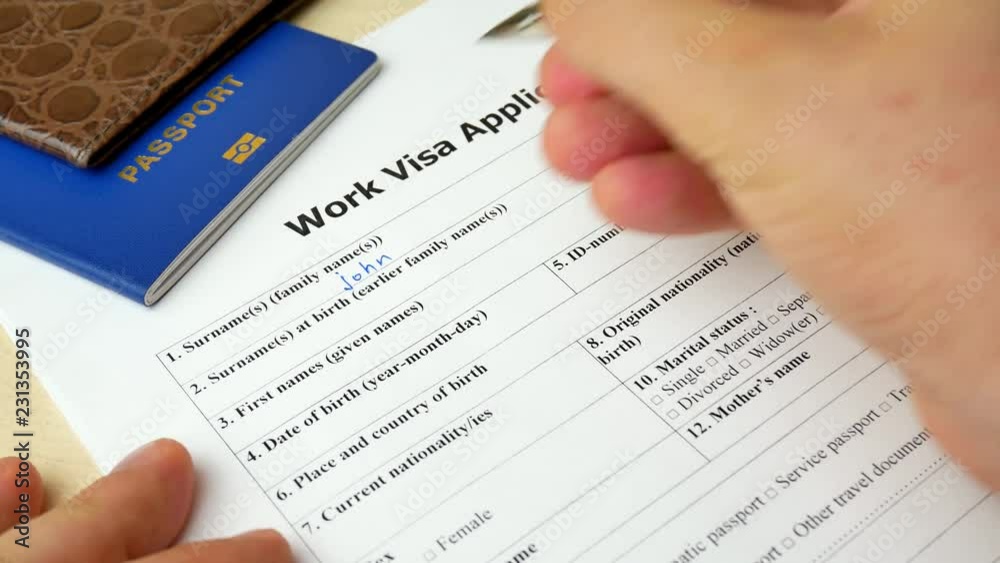 Work Visa application form with passport and pen. Document with passport, apply and permission for foreigner country