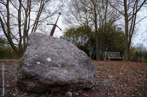 Excalibur the famous sword in the stone of king Arthur in the forest, Llangorse Lake, Brecon Beacons photo