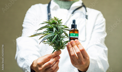doctor hand hold and offer to patient medical marijuana and oil. Cannabis recipe for personal use, legal light drugs prescribe, alternative remedy or medication,medicine concept