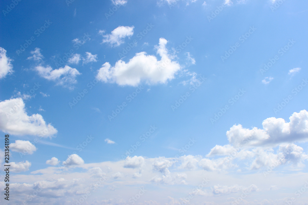 Small white clouds formation over clear blue sky Small white clouds formation over clear blue sky