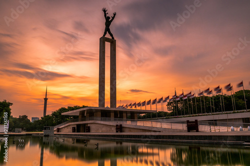 West Irian Liberation Monument in the Lapangan Banteng (Bulls Field), formerly Waterloo Square in Jakarta. Long exposure photography with beautiful golden sunrise.