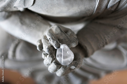 buddha hands with rock crystal
