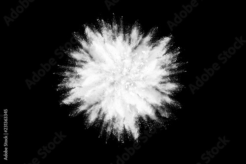 Freeze motion of white powder explosions isolated on black background.