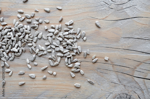 sunflower seeds on wooden background