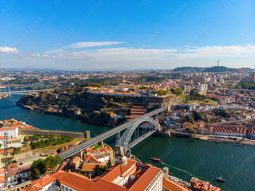 Porto Old Town and Dom Luis Bridge over the Douro river in Porto, Portugal, aerial view.