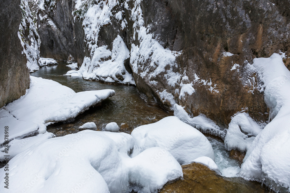 Winter in Gorge Bicaz with a stream, in Transylvania Winter in Gorge Bicaz with a stream, in Transylvania