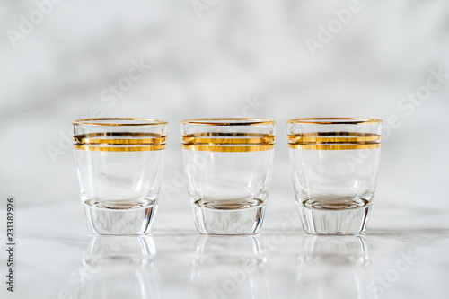 Vintage Gold Line Gilded Liquor Glass Cups on Marble