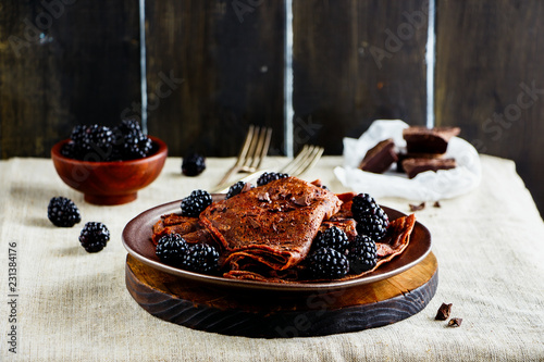 Chocolate crepes with blackberries photo