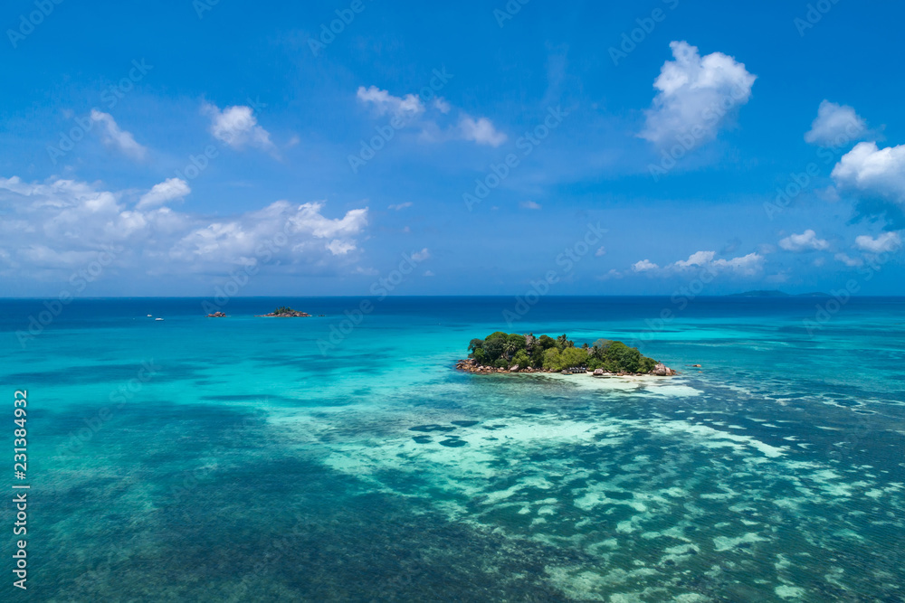 Naklejka premium Aerial view of beautiful island at Seychelles. Top view from drone