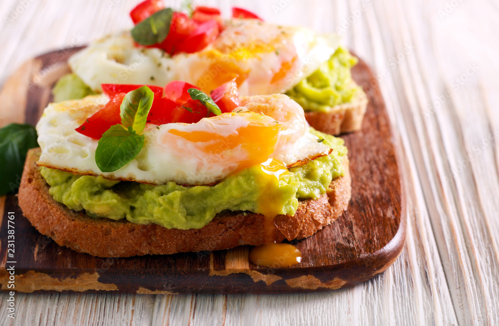 Toasts with avocado and fried egg