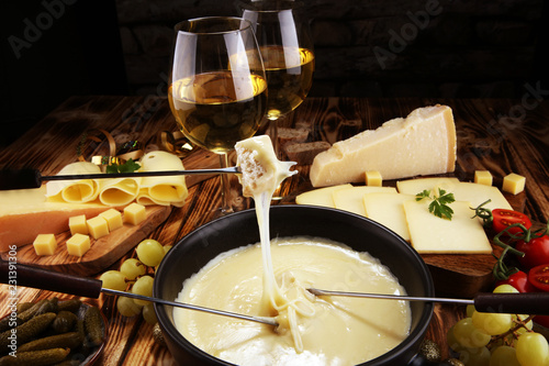 Gourmet Swiss fondue dinner on a winter evening with assorted cheese