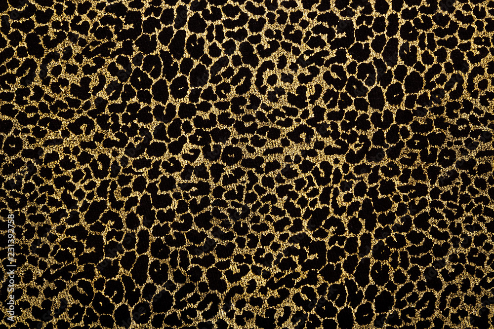 Fototapeta Black fabric with golden leopard fur print