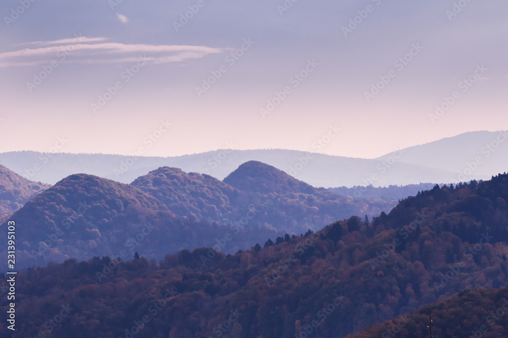 Naklejka premium Mountain landscpae with peaks of the hills at dawn