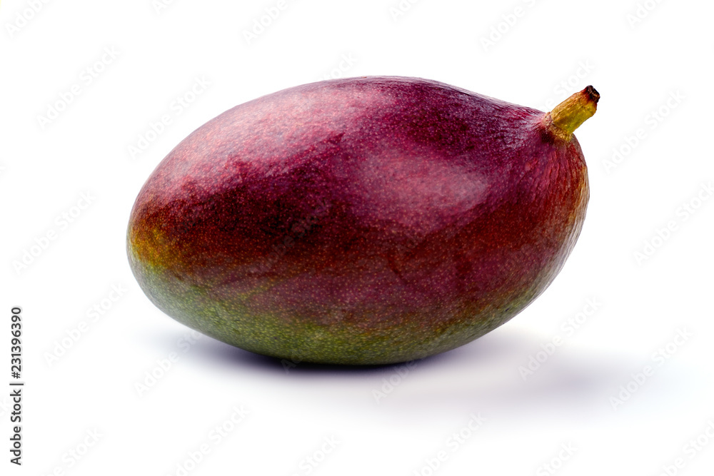 Close up fresh organic mango on light background. Tasty tropical fruit close up. Delicious exotic fruit. Close up fresh organic mango on light background. Tasty tropical fruit close up. Delicious exotic fruit.