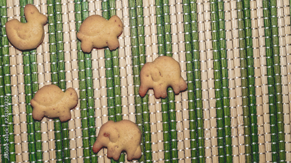 animal shape biscuits on traditional Japanese bamboo woven mat Stock