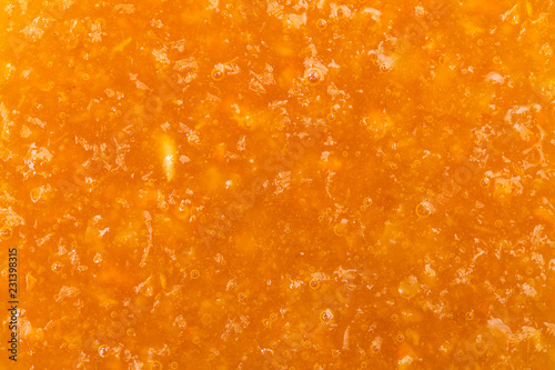 Delicious orange jam texture photo