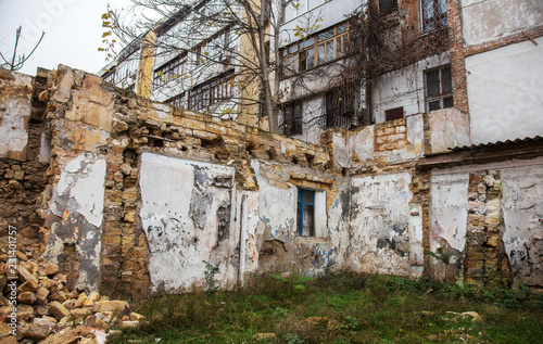 Ruins of an old abandoned city. Ruined house in which poor people live. Odessa, the ruins of a historic residential building. The ruins of an old earthquake-hit house. Lost city. © Aleksandr Lesik