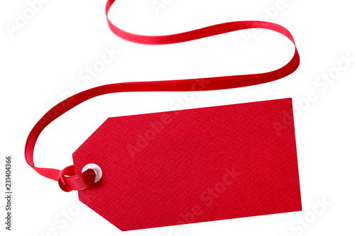 Gift tag red ribbon isolated on white close up