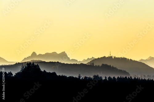 Faded misty hills and mountain range before sunrise, Mürtschenstoch and Bachtel © str0pe photography
