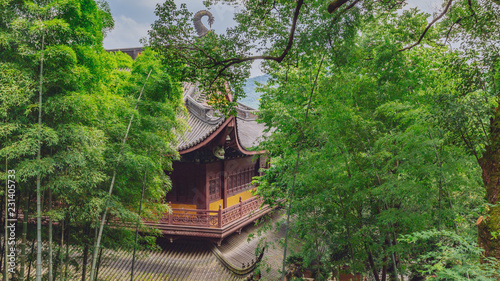 Traditional Chinese architecture among bamboos and trees, in Lingyin Temple, Hangzhou, China
