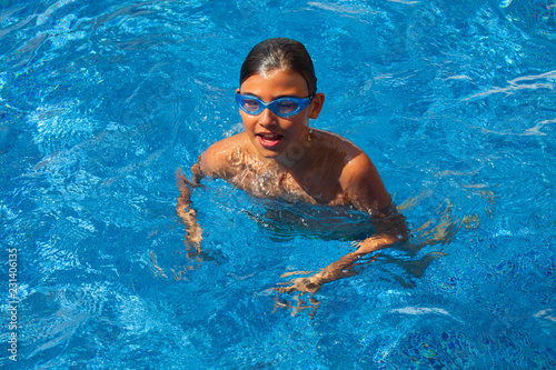 Happy boy in the swimming pool